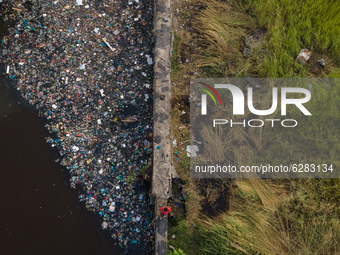 Aerial photo shows  floating plastic and styrofoam trash polluting a corner of Siak River , Pekanbaru. . The accumulation of garbage occurs...