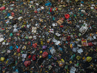 Photo shows  floating plastic and styrofoam trash polluting a corner of Siak River , Pekanbaru, ., Riau Province, Indonesia, Dec 17, 2020....