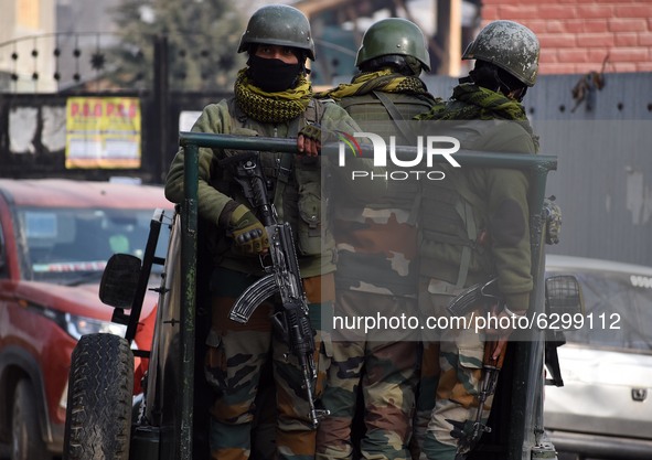 Indian security forces arive near the gun-battle site in Wanigam Payeen village of north Kashmir's Baramulla district on December 24, 2020....