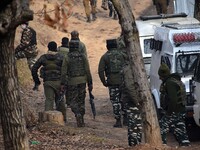  Indian security forces arive near the gun-battle site in Wanigam Payeen village of north Kashmir's Baramulla district on December 24, 2020....