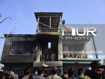 Kashmiri people surround the place where a millitant was killed outside a residential house in Kanigam Village of Shopian district, South of...