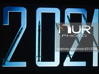 An illustrative image of medical syringes in front of 2021 image displayed on a screen.
On Thursday, December 31, 2020, in Dublin, Ireland....