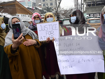 Familymembers of killed alledged militants hold placards during protest in Srinagar, Indian Administered Kashmir on 04 January 2021. Familie...