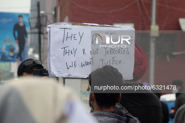 Familymembers of killed alledged militants hold placards during protest in Srinagar, Indian Administered Kashmir on 04 January 2021. Familie...