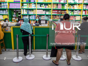 Drug store that still have a lot of vistors at the empty mall in Jakarta, Indonesia, on January, 4, 2021. Situation at A Mall in Jakarta tha...