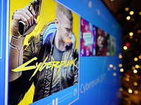 The Cyberpunk game is seen being installed on a Playstation 4 console in Warsaw, Poland on January 5, 2021. Cyberpunk 2077 was hailed as the...
