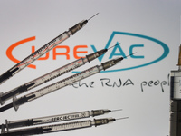 An illustrative image of medical syringes in front of CureVac logo displayed on a screen.
On Friday, January 8, 2020, in Dublin, Ireland. (