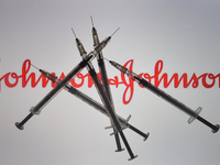 An illustrative image of medical syringes in front of Johnson and Johnson logo displayed on a screen.
On Friday, January 8, 2020, in Dublin,...