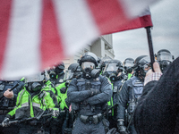 Riot police formed heavy lines near the U.S. Capitol on January 06, 2021 in Washington, DC. The protesters stormed the historic building, br...