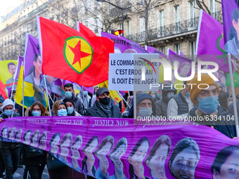 A man holds a banner 'Erdogan is responsible, he must be juger' during a march 'Justice For Sakine, Rojbin And Leyla' in Paris, France on Ja...