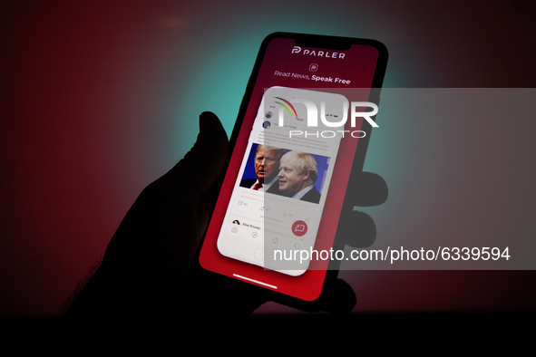 Screenshots of the Parler app from the App Store are seen on an Apple iPhone in this photo illustration in Warsaw, Poland on January 10, 202...