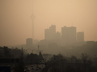 A view of the Milad telecommunication tower (L) and residential complexes in western Tehran during a polluted air, following the COVID-19 ou...