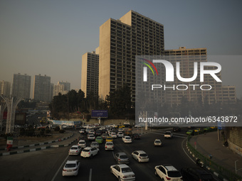 Vehicles travel on a road in northwestern Tehran during a polluted air, following the COVID-19 outbreak in Iran, on January 12, 2021. Tehran...