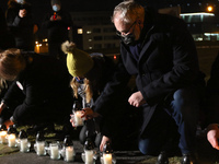 People lighting candles in a giant heart shape are seen during the Pawel Adamowicz in memoriam meeting in Gdansk, Poland on 13 January 2021...