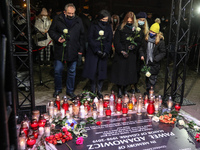 (L-R) Piotr Adamowicz, Aleksandra Dulkiewicz , Magdalena Adamowicz and her daughters in front of memorial plaque are seen during the Pawel A...