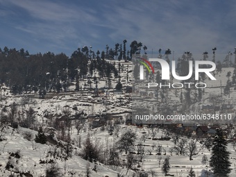Residential houses are seen in Snow covered area of Hajibal on the outskirts of District Baramulla Jammu and Kashmir India on 14 January 202...