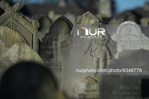 A figurine of an angel seen next to the monument commemorating more than 200 children from Bethany Mother and Child Home at Mount Jerome Cem...