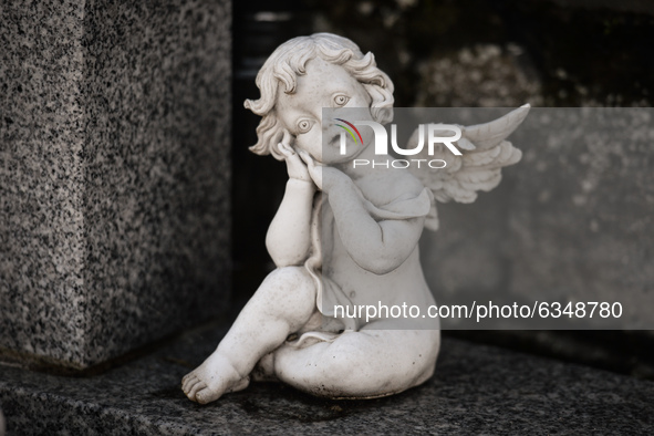 A figurine of an angel seen next to the monument commemorating more than 200 children from Bethany Mother and Child Home at Mount Jerome Cem...