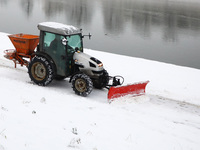 A snow plough is cleaning Vistula boulevards covered with snow in Krakow, Poland. January 14, 2021.  (