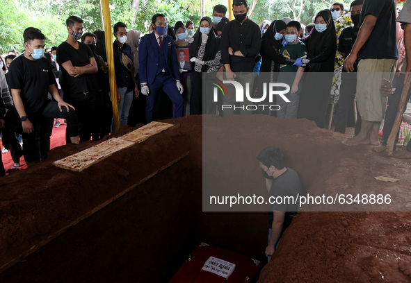 Relatives of Okky Bisma, a flight attendant and one of the 62 passengers aboard Sriwijaya Air flight SJ182 which crashed shortly after takeo...