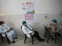 First batch of health workers wait for their turn to get vaccinated,  at a hospital  in Allahabad on January 16,2021.India started inoculati...