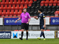 Referee, Brett Huxtable talks with Nat Knight-Percival of Morecambe (R) of Leyton Orient during the Sky Bet League Two match between Leyton...