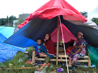 The survivors of residents are sitting in refugee tents at the Manakarra Stadium refugee post, Mamuju Regency, West Sulawesi Province, Indon...