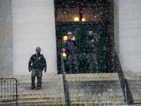Ohio State Patrol officers guard stand guard during an armed protest at the Ohio Statehouse ahead of the inauguration of President-elect Joe...