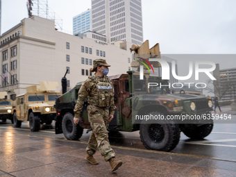 Ohio National Guard vehicles arrive downtown during an armed protest at the Ohio Statehouse ahead of the inauguration of President-elect Joe...
