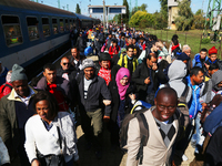 Migrants arrive by train to Hegyeshalom train station near the Hungarian-Austrian border. Hegyeshalom, Hungary. 28 September 2015. A record...