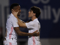 Eder Militao of Real Madrid celebrates with Alvaro Odriozola after scoring his sides first goal during the round of 32 the Copa del Rey matc...