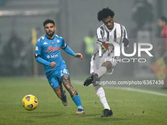 Juan Cuadrado of Juventus FC and Lorenzo Insigne of SSC Napoli compete for the ball during the Italian PS5 Supercup Final match between FC J...