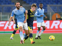 Vedat Muriqi of SS Lazio and Daan Dierckx of Parma Calcio 1913 compete for the ball during the Coppa Italia match between SS Lazio and Parma...