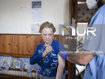 A resident of the nursing home is seen while being vaccinated on January 22, 2021, in Norena, Spain. (
