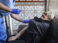 A resident of the nursing home is seen while being vaccinated on January 22, 2021, in Norena, Spain. (