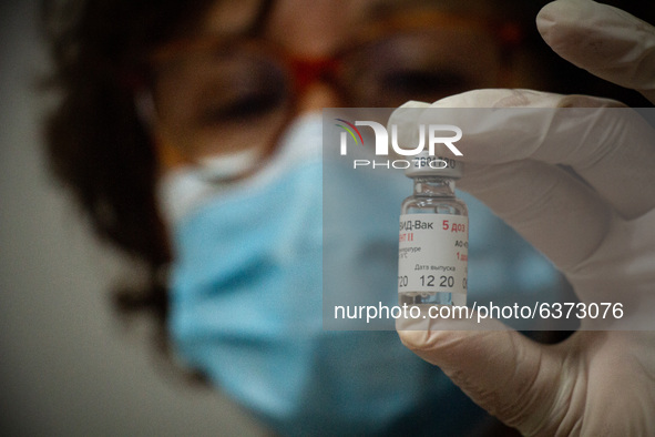 Health worker of Hospital Posadas in Buenos Aires show the Sputnik V vaccine in Buenos Aires, Argentina, on January 22, 2021. 