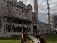 Visitors taking photos in front of the Suleymaniye Mosque in Istanbul, Turkey on January 22, 2021.  (