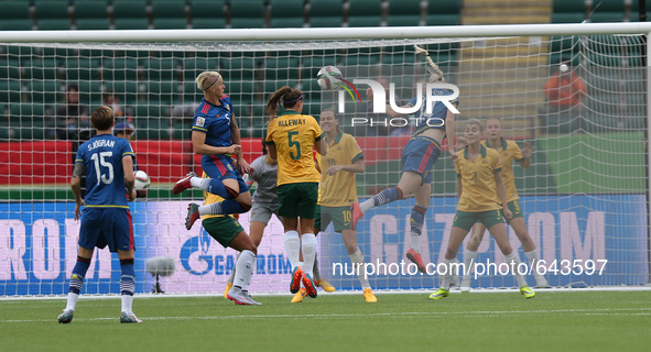 (150617) -- EDMONTON, June 17, 2015 () -- Amanda Ilestedt (3rd R) of Sweden heads the ball during the group D match against Australia at the...