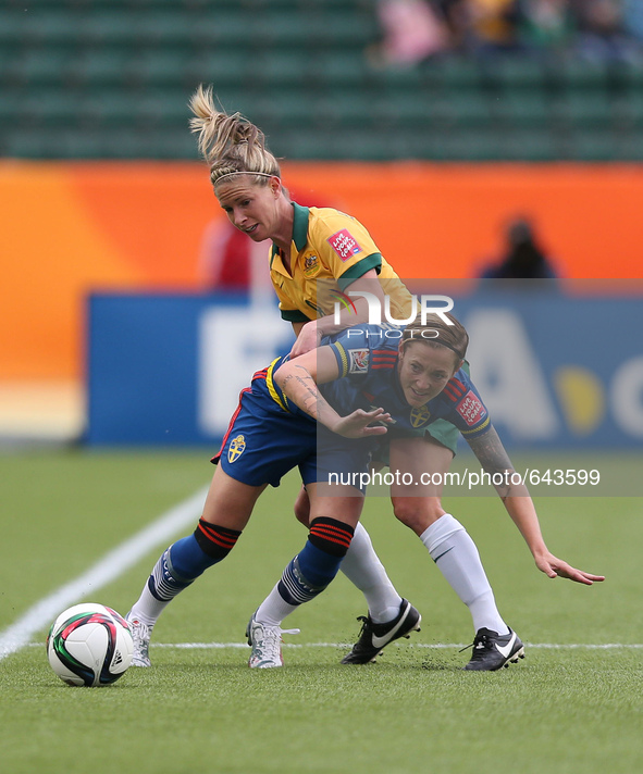 (150617) -- EDMONTON, June 17, 2015 () -- Lotta Schelin (below) of Sweden vies with Elise Kellond-Knight of Australia during the group D mat...