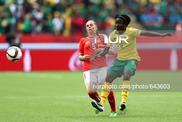 EDMONTON, June 17, 2015 () -- Francine Zouga (L) of Cameroon vies with Noelle Maritz of Switzerland during their group C match at the 2015 F...