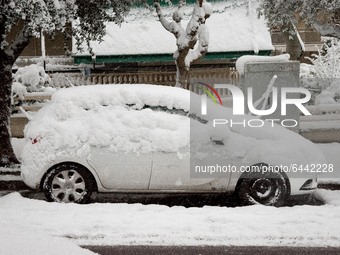 A snow covered car in the area of Zografou in Athens, Greece on February 16, 2021. The snowfall called 'Medea' showed up in Greece. (