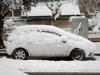 A snow covered car in the area of Zografou in Athens, Greece on February 16, 2021. The snowfall called 'Medea' showed up in Greece. (
