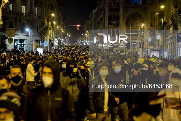 People take part in a demonstration against the imprisonment of rapper Pablo Hasel, in Barcelona, Spain, on February 19, 2021. Violent stree...