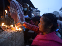 Nepalese Hindu devotees offering rituals during last day of a month fasting festival of Madhav Narayan Festival at Hanumanghat River, Bhakta...