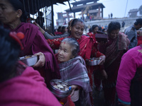 Nepalese Hindu devotees arrive to offer rituals during last day of a month fasting festival of Madhav Narayan Festival at Hanumanghat River,...