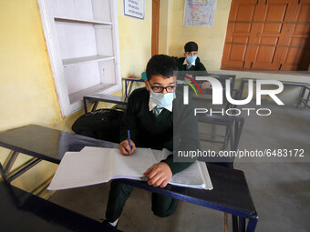  A student wearing a face mask as he attends attend a class in Srinagar,Kashmir on March 01 ,2021.Schools across the Kashmir valley re-opene...