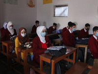  Students wearing face masks as they attend a class in Srinagar,Kashmir on March 01 ,2021.Schools across the Kashmir valley re-opened after...