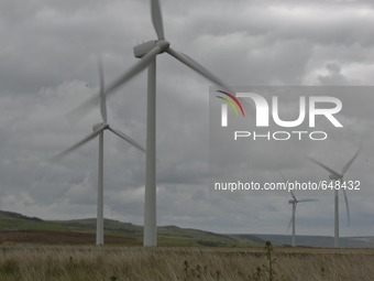 Turbines at the Coal Clough wind farm, on Sunday 21st June 2015, generating electricity for the United Kingdom's energy supply network known...