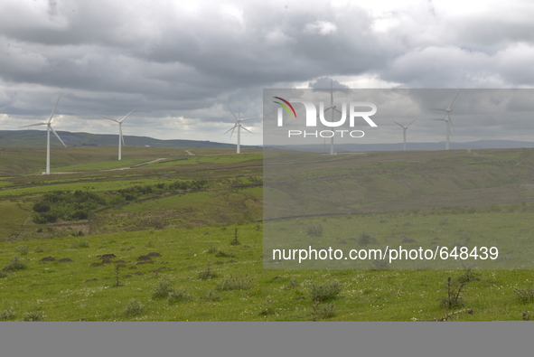 Turbines at the Coal Clough wind farm, on Sunday 21st June 2015, generating electricity for the United Kingdom's energy supply network known...