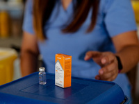 A nurse shows the Sinovac COVID19 vaccine to the media during a ceremonial vaccination program held inside a sports stadium in Marikina City...